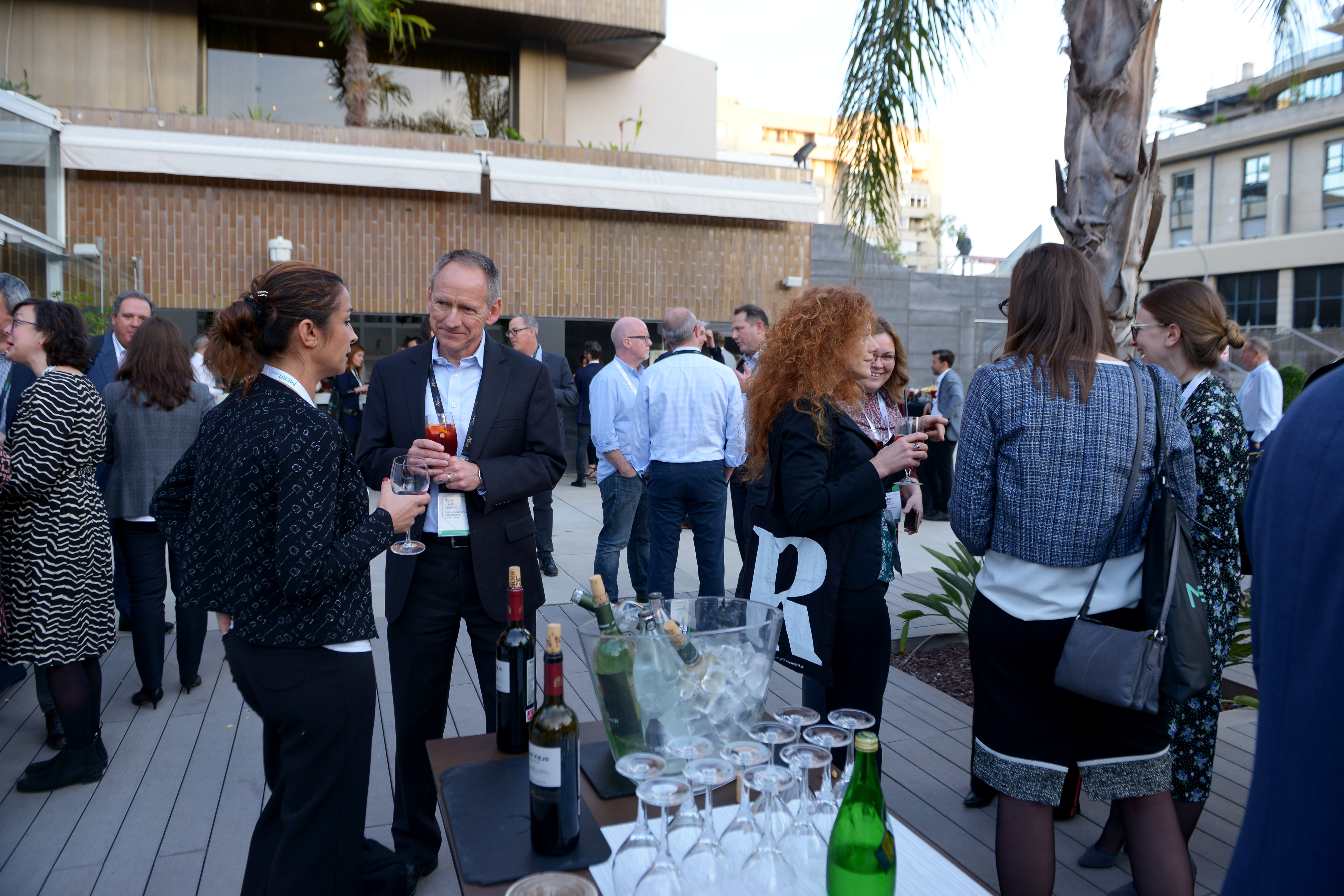 HR, L&D, and academic delegates gather at a cocktail at the MERIT Annual Summit in Seville.